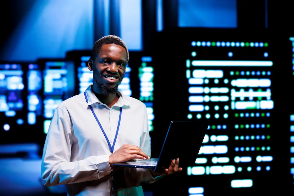 Certified technician configuring network switch panel